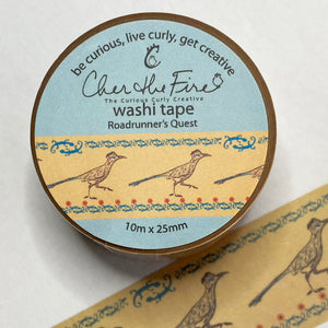 Roadrunner washi tape with roadrunners facing right with an edging of teal decoration and lizards on the top and teal with red flowers on the bottom